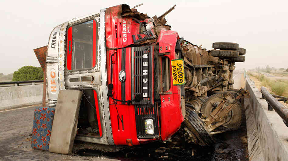 An overturned truck carrying plastic goods closed a portion of the Grand Trunk Road between Varanasi An overturned truck carrying plastic goods closed a portion of the Grand Trunk Road between Varanasi