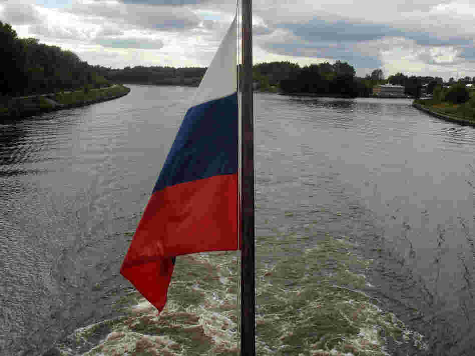 The Russian flag hangs from a cruise ship travelling down the Volga River.