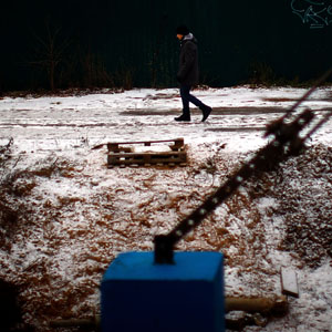 A man walks along iced-over train tracks along the Trans-Siberian railroad. (David Gilkey/NPR)