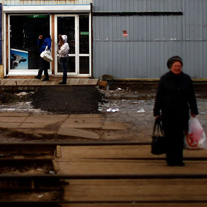 A woman waits for a local train at a small station along the Trans-Siberian railroad. (David Gilkey/NPR)