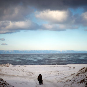 Storm clouds pass over Lake Baikal in Siberia. Baikal is the world's largest and oldest lake, and is estimated to hold close to 20 percent of the world's fresh water. When the lake freezes, residents can drive across the ice. (David Gilkey/NPR)