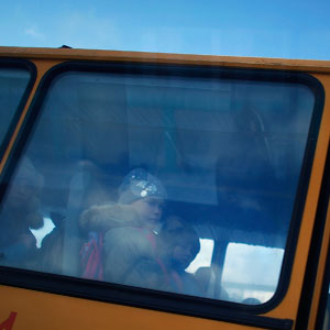 Schoolchildren take the bus home from classes in the town of Posolske, on Lake Baikal. (David Gilkey/NPR)