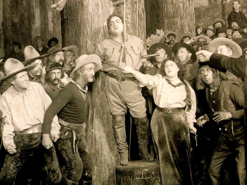 Enrico Caruso (center) stars in Puccini's "La Fanciulla del West"