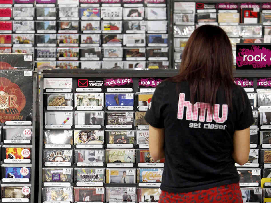 Stocking shelves; credit: Bloomberg via Getty Images 