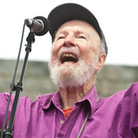 Pete Seeger leads the crowd at Newport Folk. Pete Seeger leads the crowd at Newport Folk.