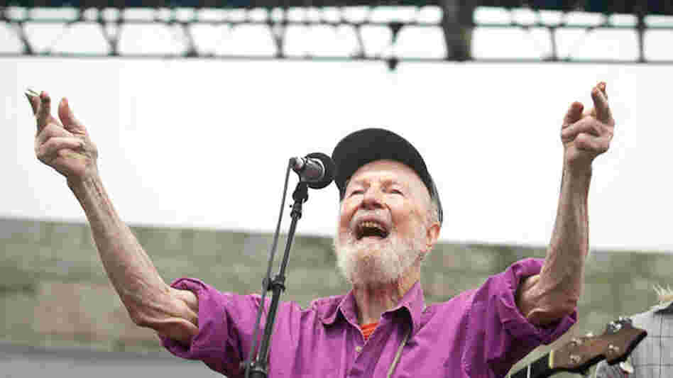 Pete Seeger leads the crowd at Newport Folk.