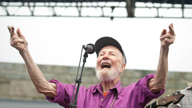 Pete Seeger leads the crowd at Newport Folk.
