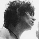 A young Keith Richards, barechested and with an acoustic guitar. A young Keith Richards, barechested and with an acoustic guitar.