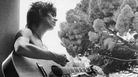 A young Keith Richards, barechested and with an acoustic guitar. A young Keith Richards, barechested and with an acoustic guitar.