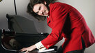 A man annihilates the ivories. A man annihilates the ivories.