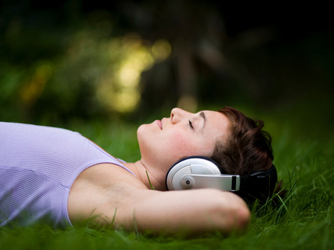 woman in headphones at night