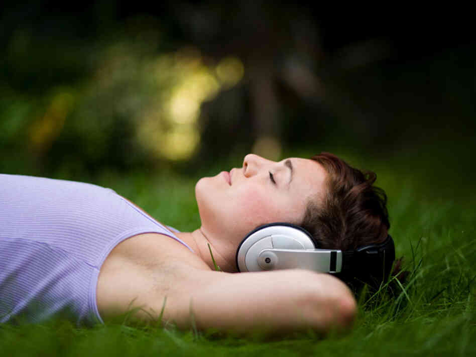 woman in headphones at night