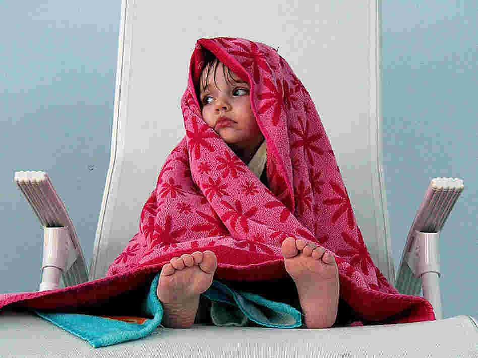 Littel girl in a towel; credit: mitjamavsar / Flickr