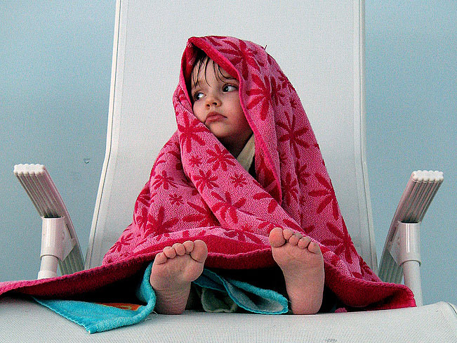 Littel girl in a towel; credit: mitjamavsar / Flickr