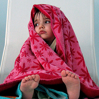 Littel girl in a towel; credit: mitjamavsar / Flickr