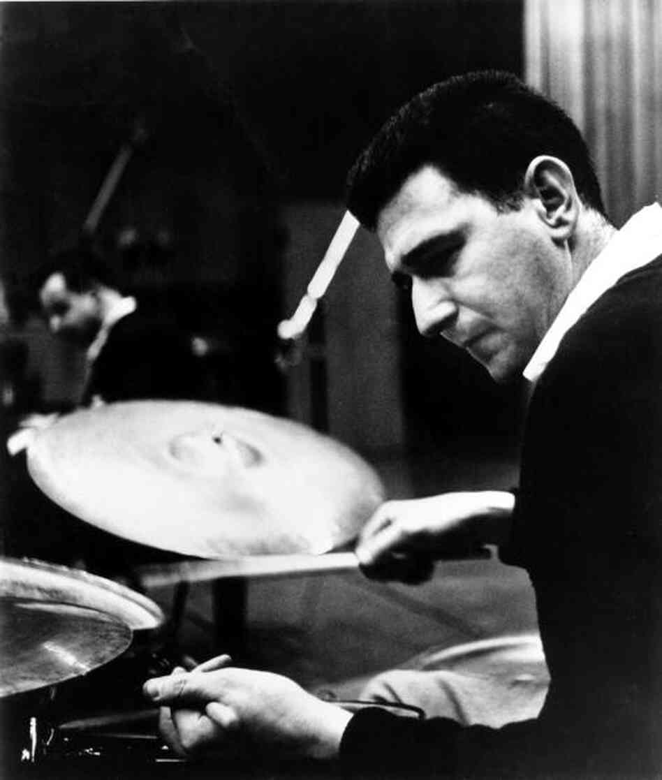Shelly Manne achieved many tonal colors in drumming by using sticks, brushes, mallets, his hands... whatever it took to get the sound he wanted. Shelly Manne achieved many tonal colors in drumming by using sticks, brushes, mallets, his hands... whatever it took to get the sound he wanted.