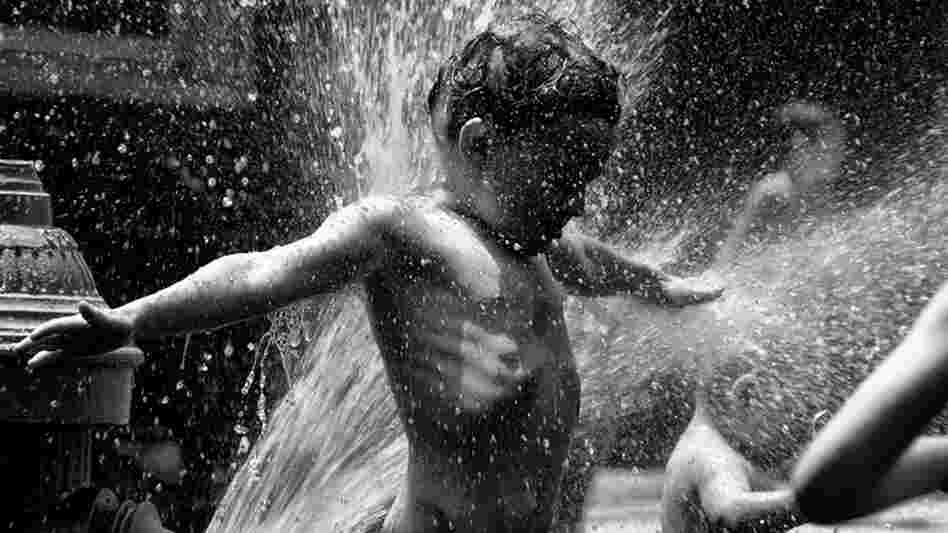 Kid plays in front of a fire hydrant; credit: vcferry via Flickr