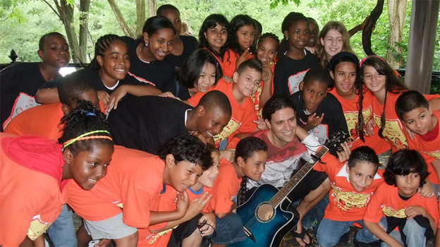 PS 22 Chorus takes a break from rehearsals in Central Park for a group photo.