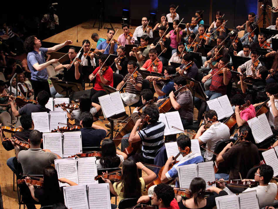 Conductor Gustavo Dudamel leads El Sistema during a June 2009 rehearsal in Caracas, Venezuela.