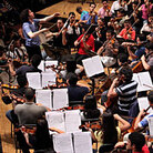 Conductor Gustavo Dudamel leads El Sistema during a June 2009 rehearsal in Caracas, Venezuela.