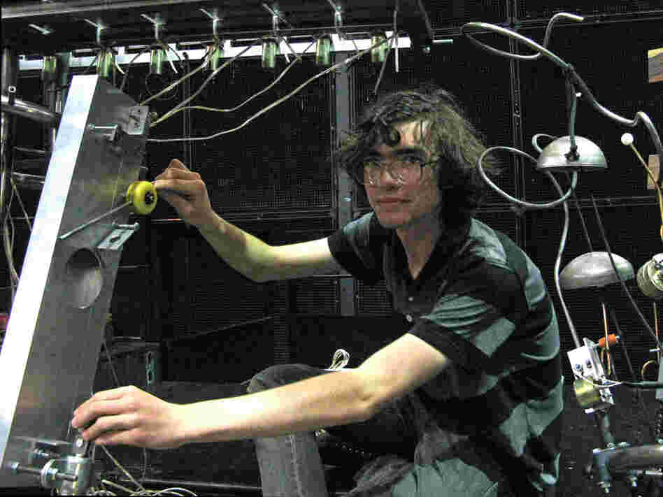 A CalArts student shows off his robot.