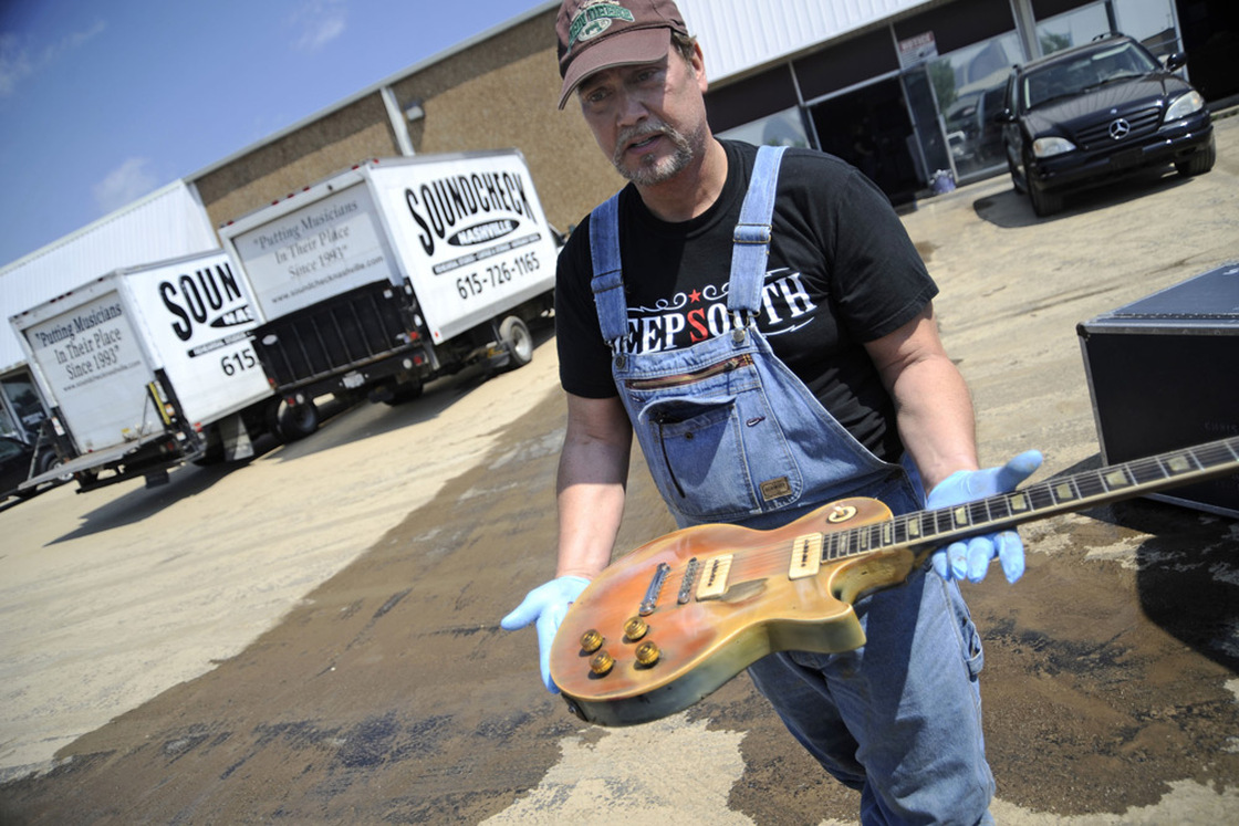 Brent Ware inspects a 1952 Gibson Les Paul that was kept at Soundcheck.