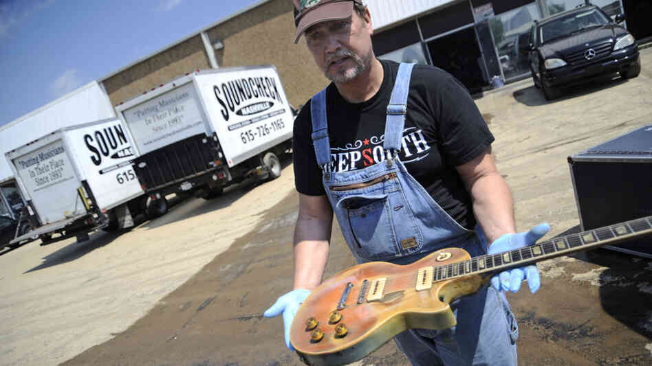 Brent Ware inspects a 1952 Gibson Les Paul that was kept at Soundcheck.