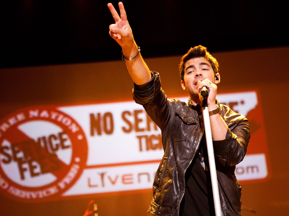 Jonas Brothers perform at a Live Nation event.