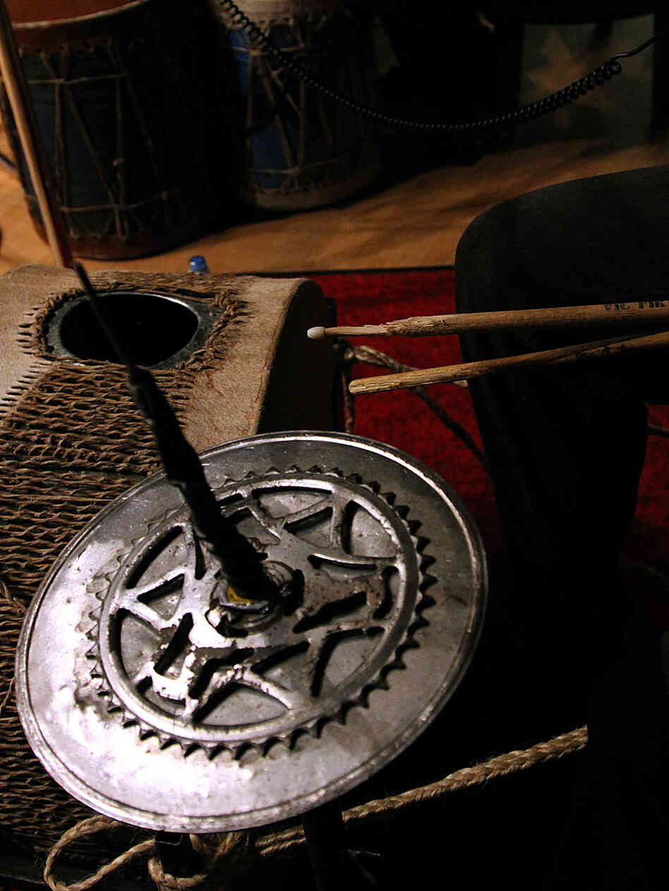Kenge Kenge often makes its instruments out of recycled material, like this tin drum. Kenge Kenge often makes its instruments out of recycled material, like this tin drum.