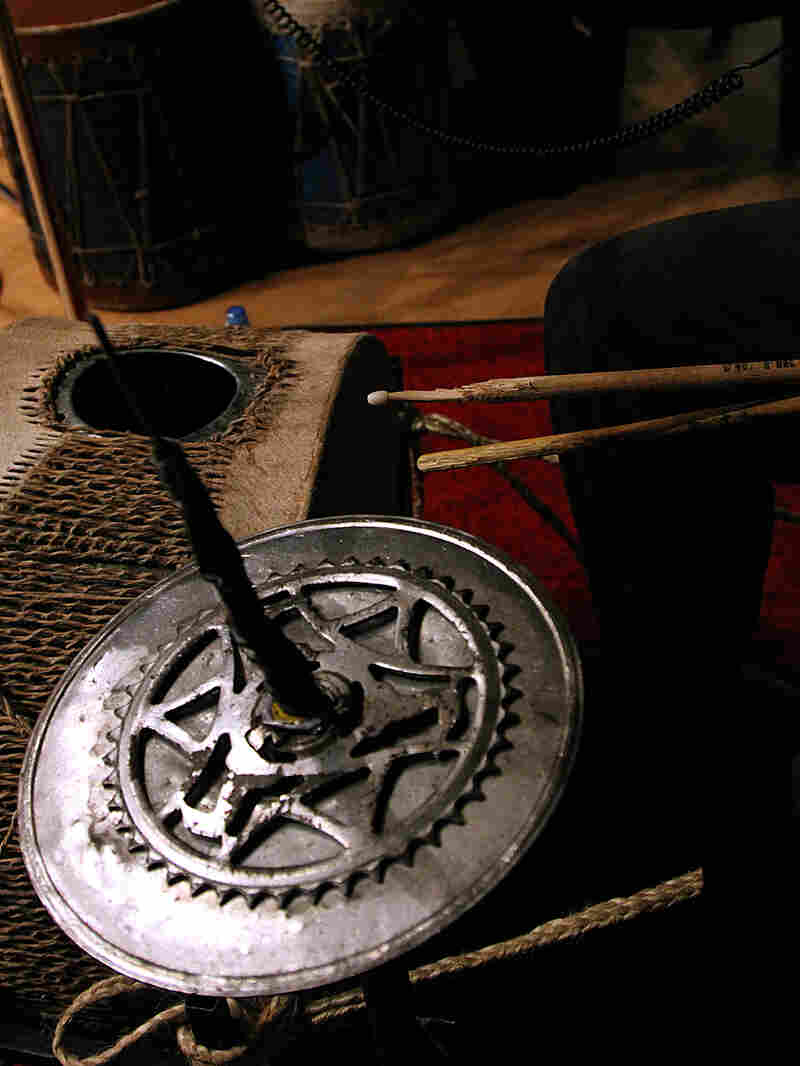 Kenge Kenge often makes its instruments out of recycled material, like this tin drum. Kenge Kenge often makes its instruments out of recycled material, like this tin drum.