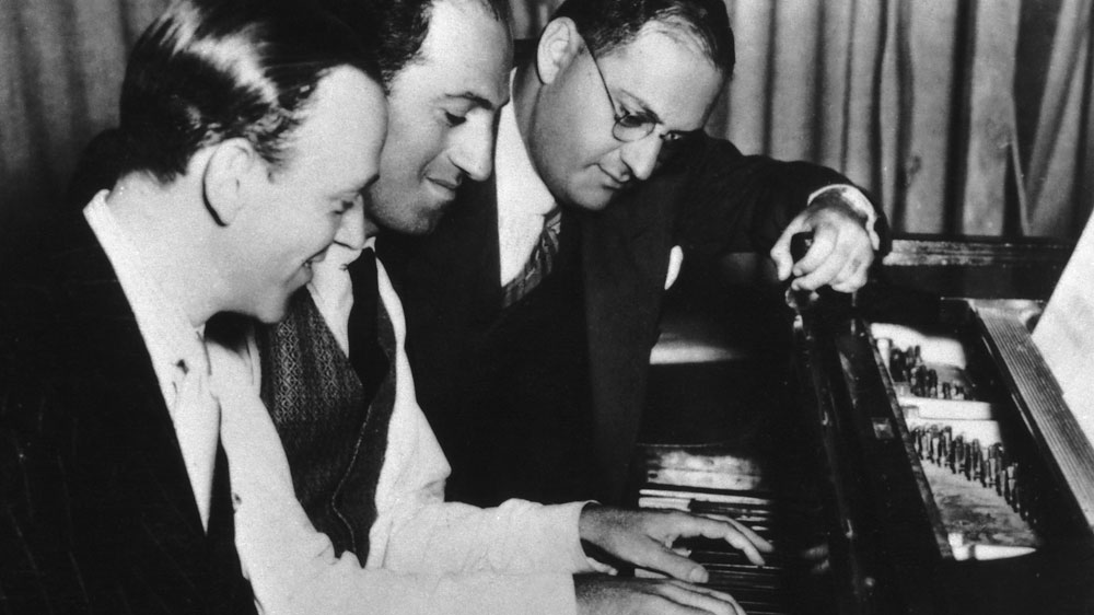 Composer George Gershwin (center) with brother Ira (right) and Fred Astaire