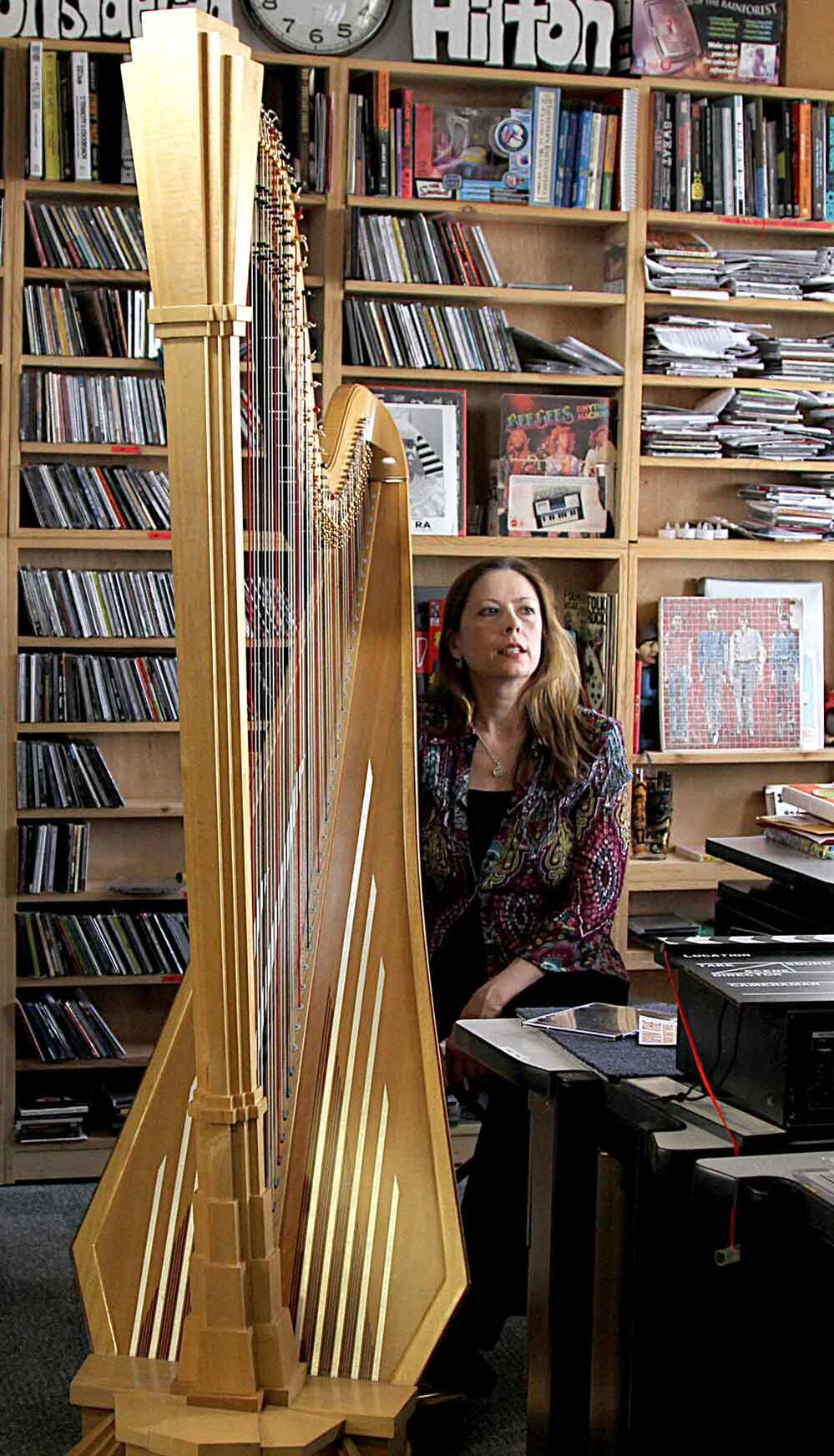 Yolanda Kondonassis next to her Art Deco-inspired harp at NPR.