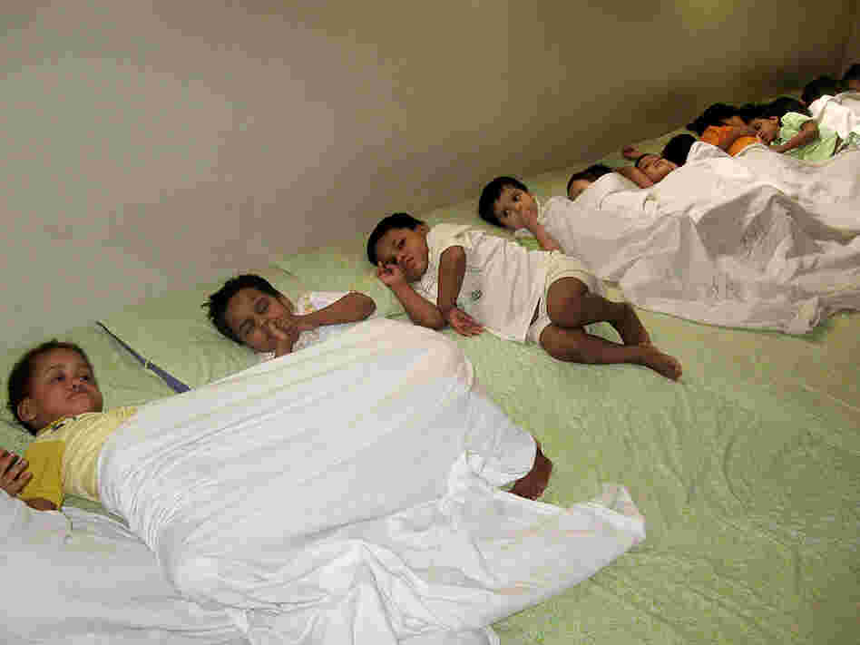 Toddlers take a rest at one of the Edhi Foundation's orphanages in Karachi.