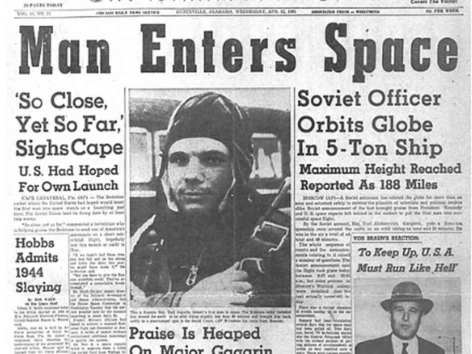A newspaper announces the first manned space flight.