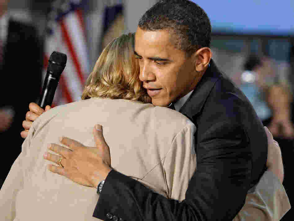President Obama hugs Virginia Organizing Project volunteer Debby Smith.