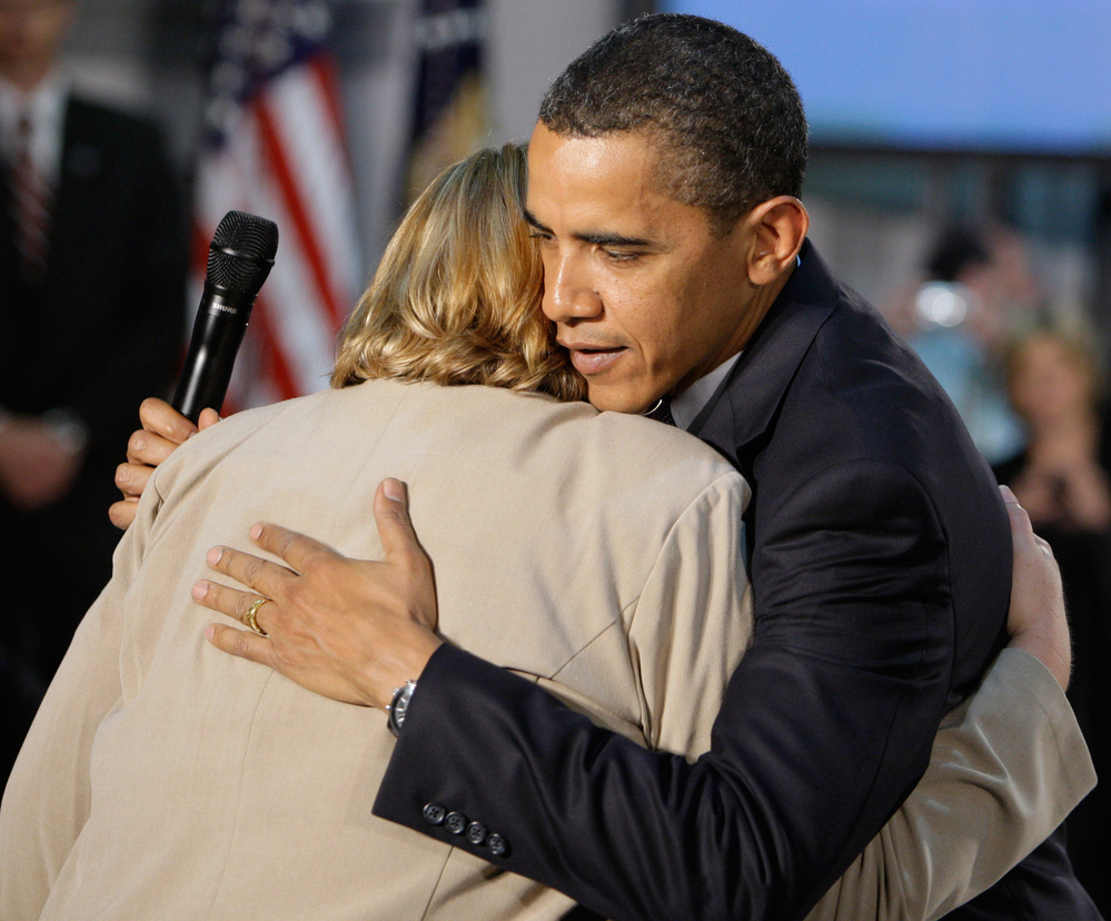 President Obama hugs Virginia Organizing Project volunteer Debby Smith.