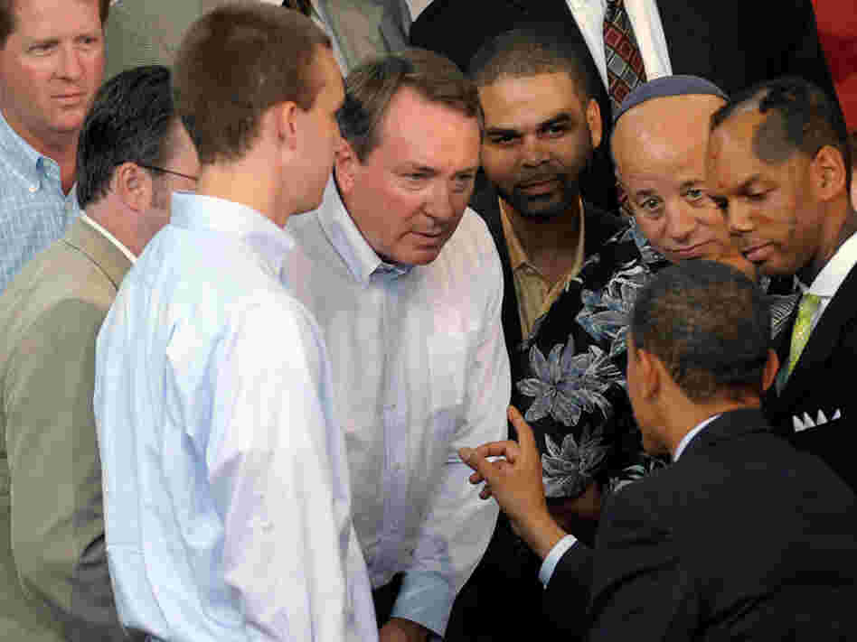 President Obama talks with a group of small-business owners about health care.