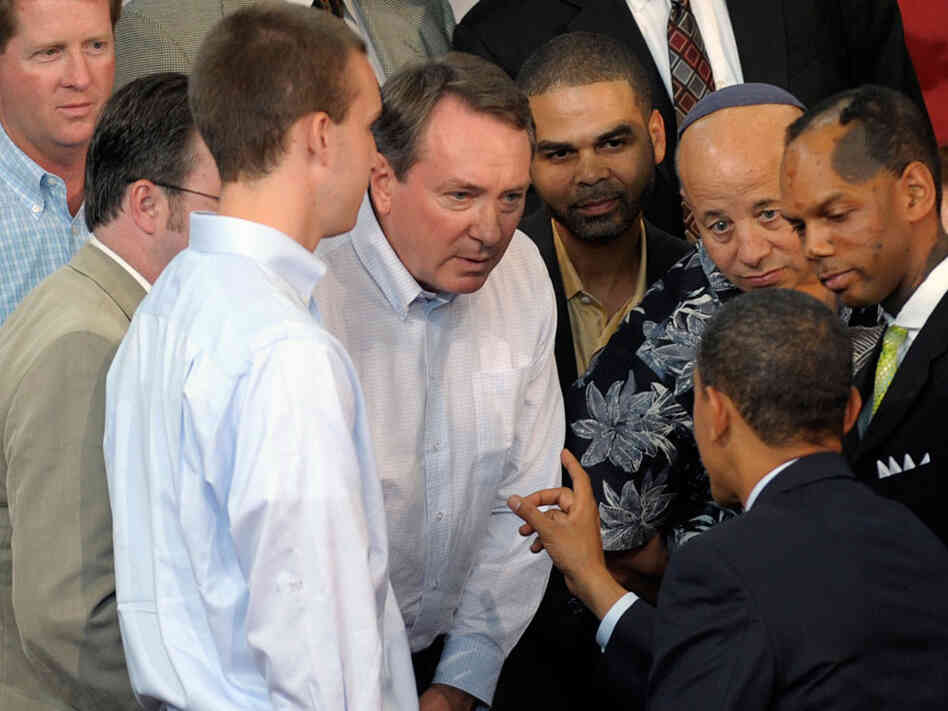 President Obama talks with a group of small-business owners about health care.