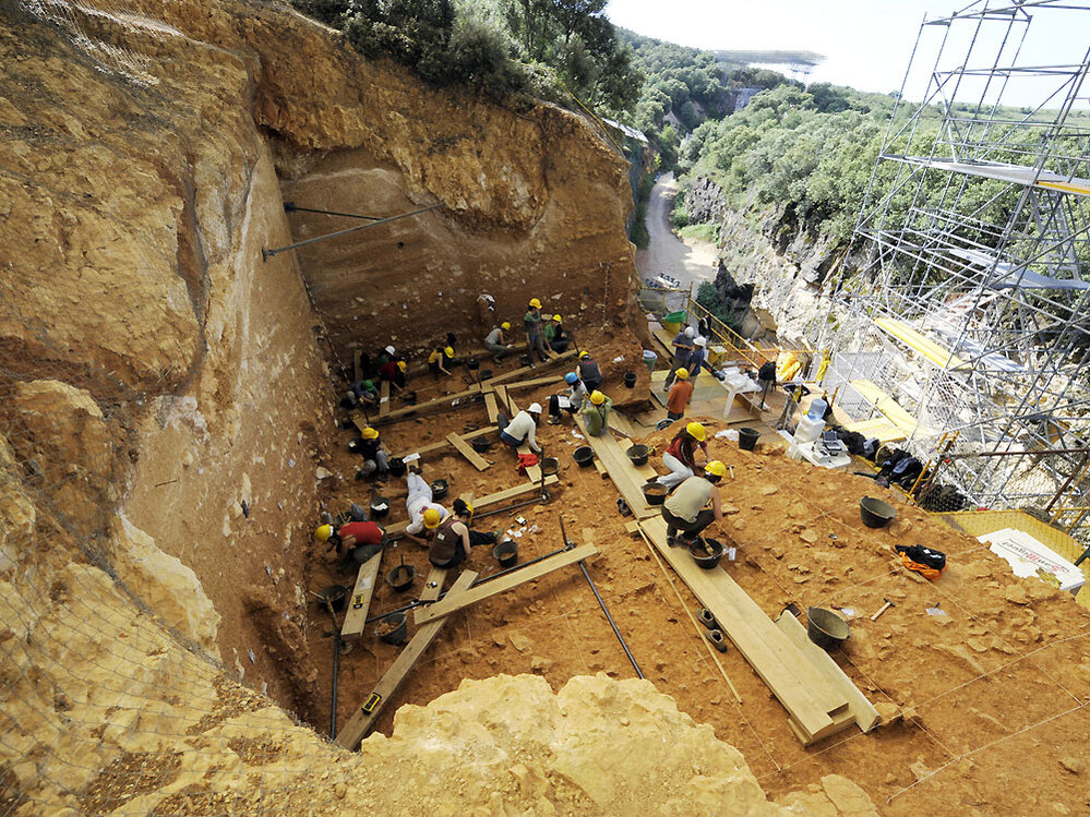 Workers excavate a section of the Sierra de Atapuerca mountains in northern Spain.