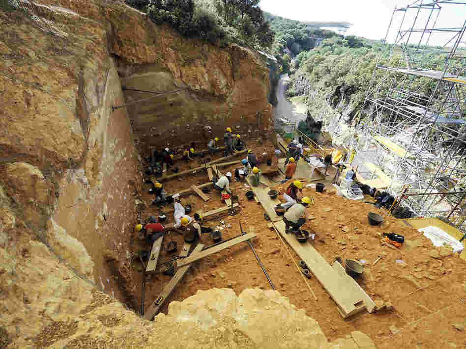 Workers excavate a section of the Sierra de Atapuerca mountains in northern Spain.