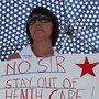 Protesters argue their positions outside Obama's townhall Tuesday. Protesters argue their positions outside Obama's townhall Tuesday.
