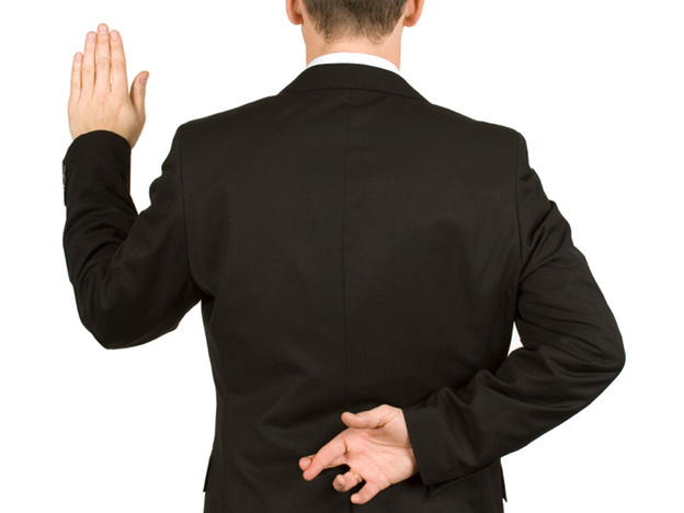 Man with fingers crossed behind his back