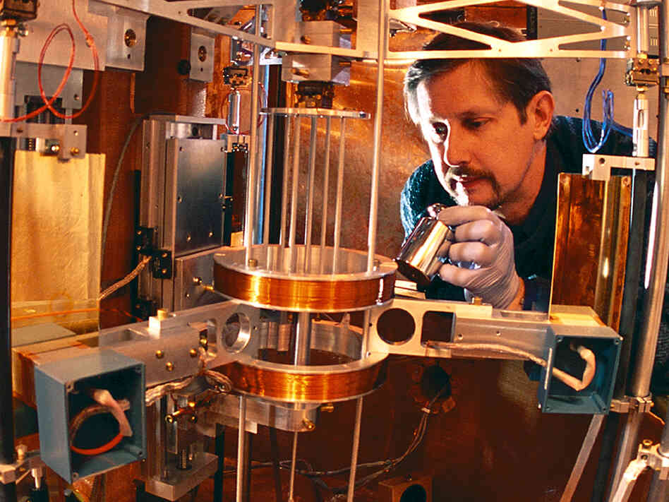Physicist Richard Steiner adjusts the watt balance.