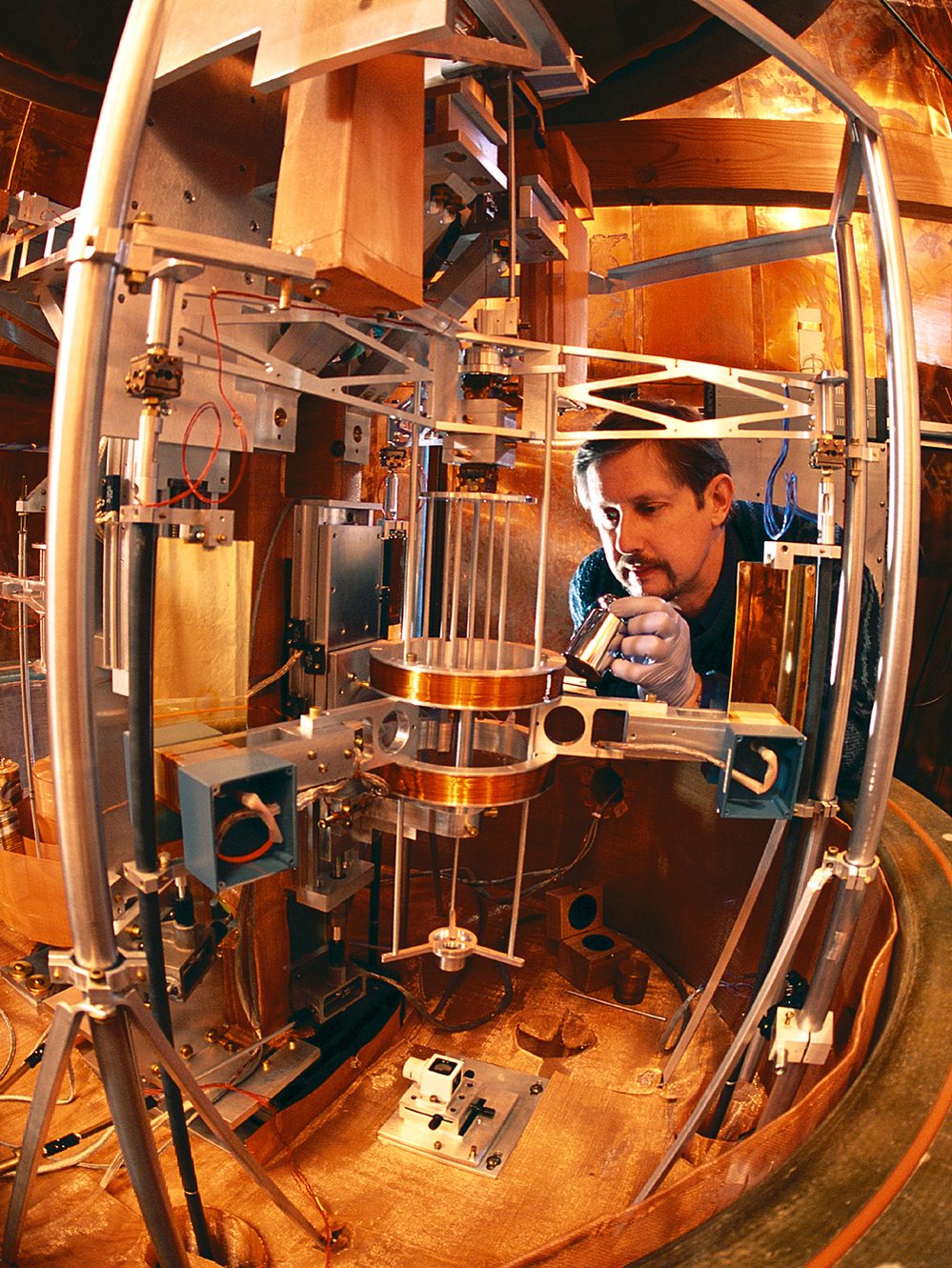 Physicist Richard Steiner adjusts the watt balance.