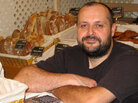 Baker Bertrand Houlier with the sweet treats and breads he makes Baker Bertrand Houlier with the sweet treats and breads he makes