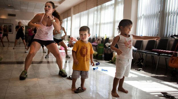 Rosina Aguiar of McLean, Va., brought her kids to the Mommy Bootie Camp workout.