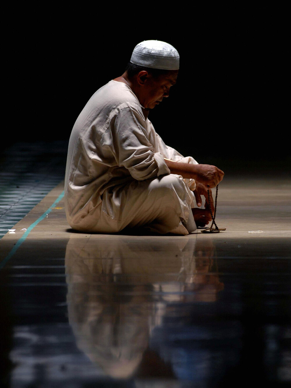 Vertical Muslim prays during Ramadan