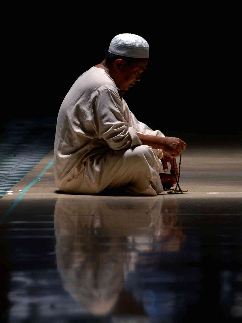 Vertical Muslim prays during Ramadan