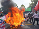 Iranian hard-line students burn U.S. and British flags, June 2009 Iranian hard-line students burn U.S. and British flags, June 2009