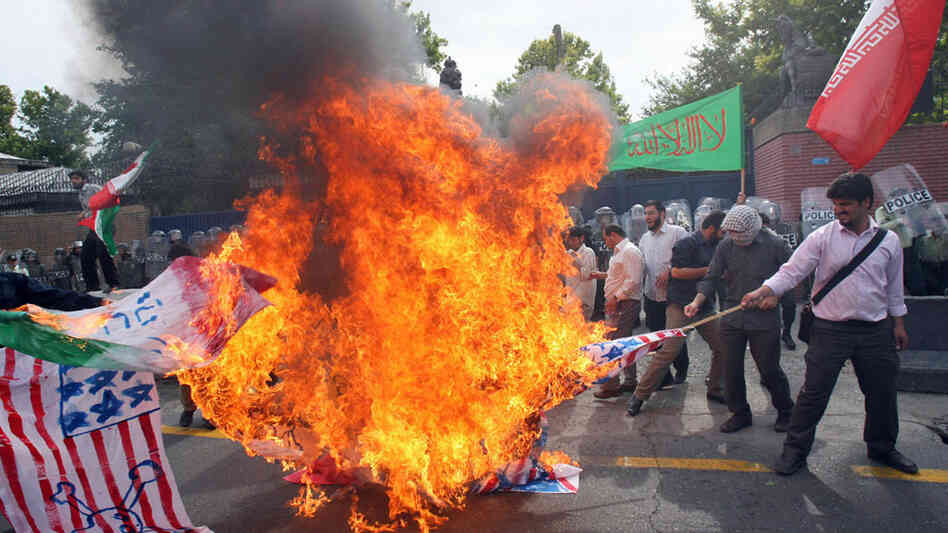 Wide: Iranian hard-line students burn U.S. and British flags, June 2009